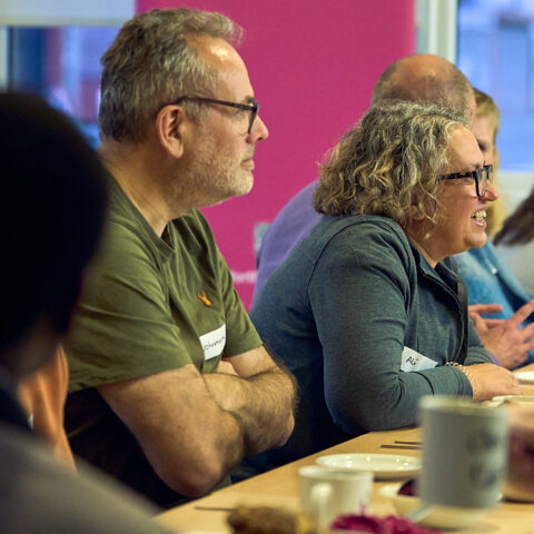Image shows attendees at a workshop